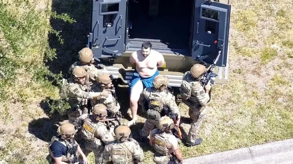 SWAT team arrest suspect wearing only a towel after student's remains ...