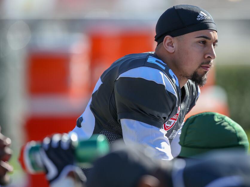 Former college football player and NFL scout charged with fatally