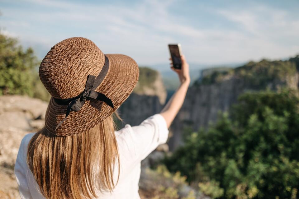 Travel Photography Ruins Some Trips and Improves Others. The Difference Is More Specific Than Just Putting the Phone Down.