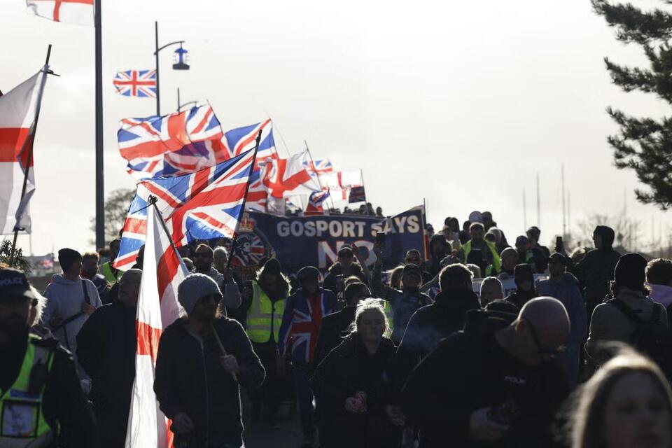 Hundreds join anti-migrant march near planned immigration removal ...