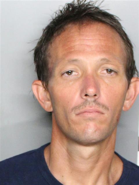 Man accused of pointing gun at woman driving by; child was in the car ...