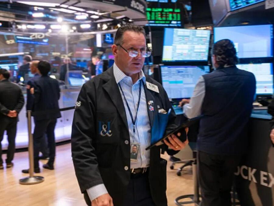 Stock futures are little changed after Dow closes at another record