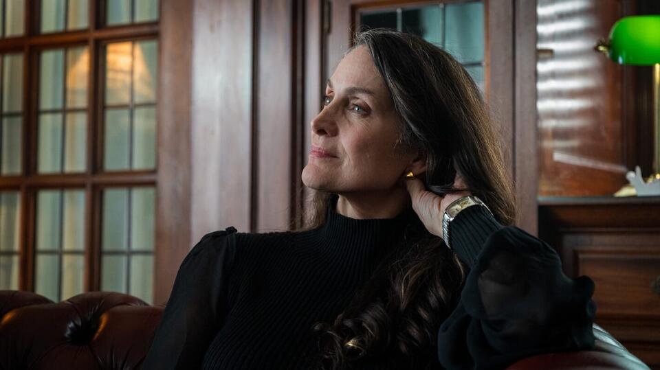 Carrie-Anne Moss Explains ‘Yaga’s Sexy Cat & Mouse Game With Noah Reid