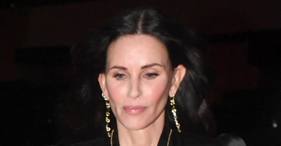 Courteney Cox Goes Dark in Silky Top, Velvet Skirt and Caged Boots With Boyfriend at Brit Awards – NewsBreak