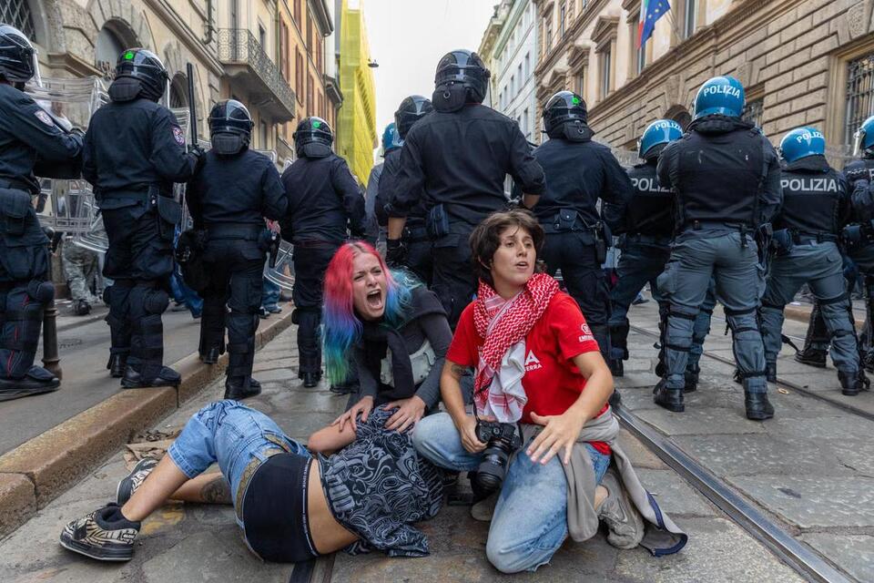 Rioters loot stores, set fires in central Milan during cost-of-living ...