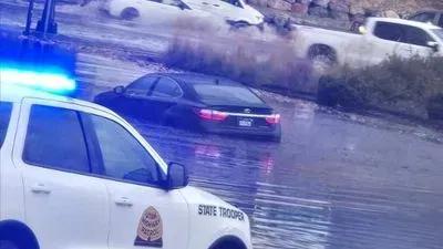 Car caught in flooding on I-15 ramp near Hill Field Road in Layton ...