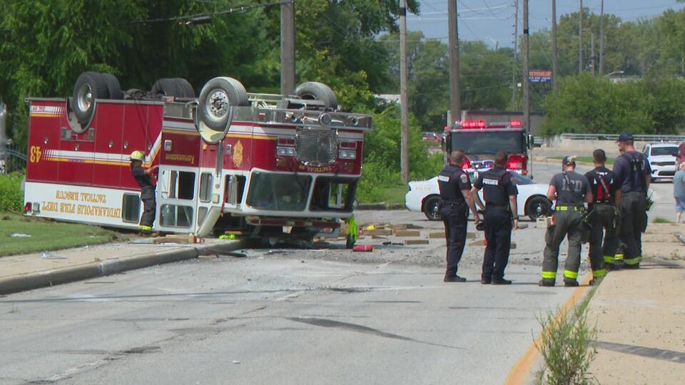 Man dies after crashing into parked semi, firetruck flips over en route ...