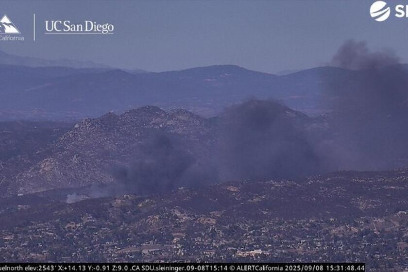 Fire burns as many as a dozen homes in San Diego County community ...