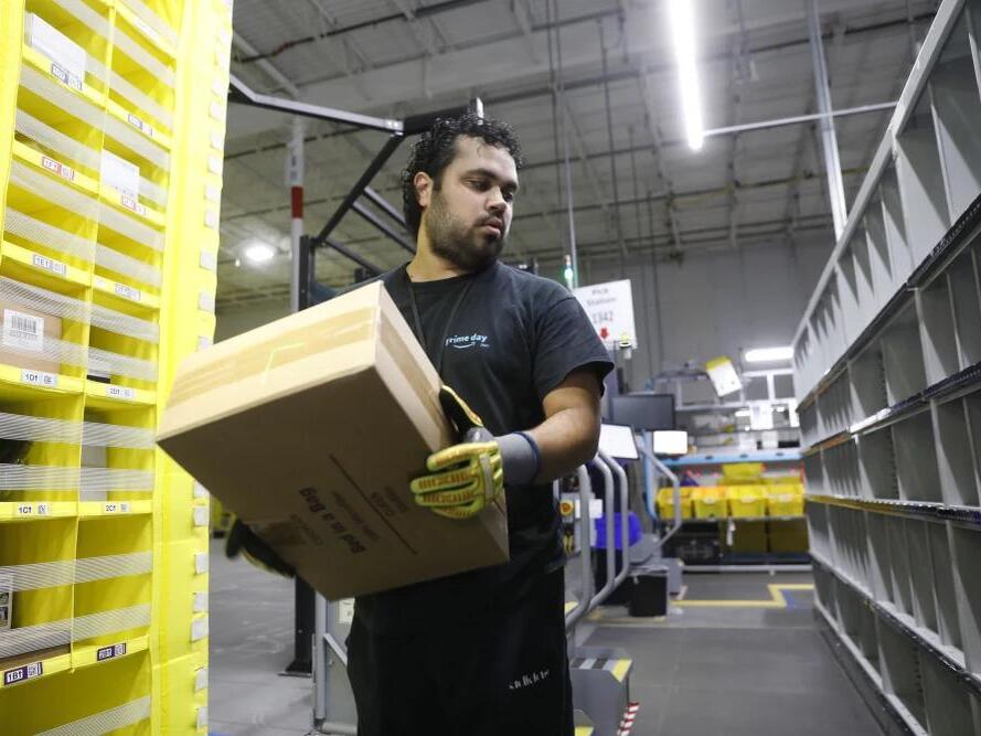 Amazon increases average pay for warehouse workers and adds free Prime