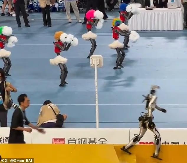 Humanoid robot falls down the stairs after getting distracted by a ...