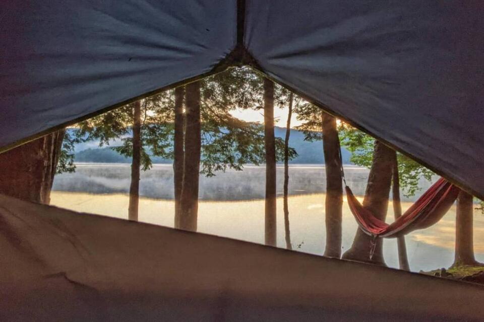 The Catskills' best-kept summer secret: this hidden beach campground with a massive 120-acre lake, waterfront campsites, & boat rentals is just 2.5 hours from NYC