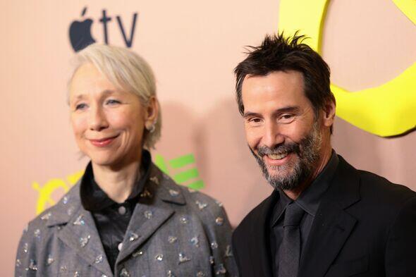Keanu Reeves poses at Outcome premiere with girlfriend after dodging ...
