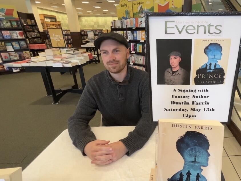 Barnes & Noble employee signs his own books