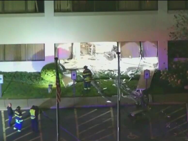 Driver hospitalized after crashing into Deerfield dental office fire