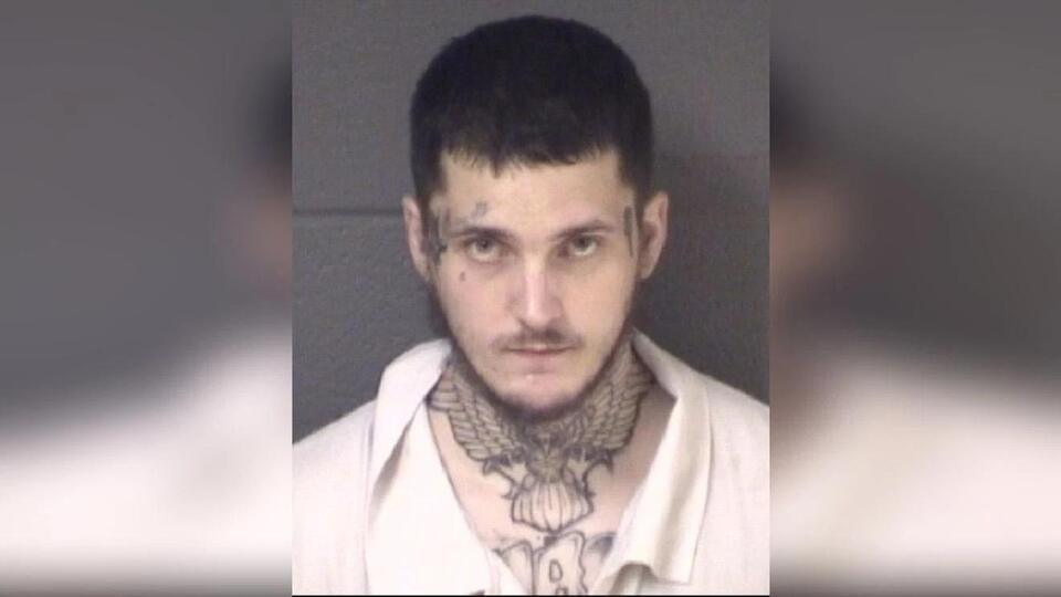Man arrested on gun and drug charges at West Asheville business, police ...