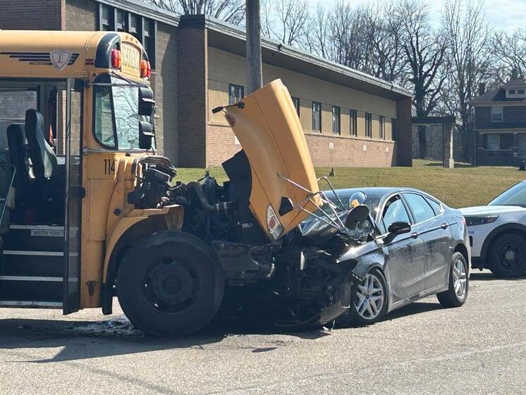 School bus carrying students, car heavily damaged following crash in ...