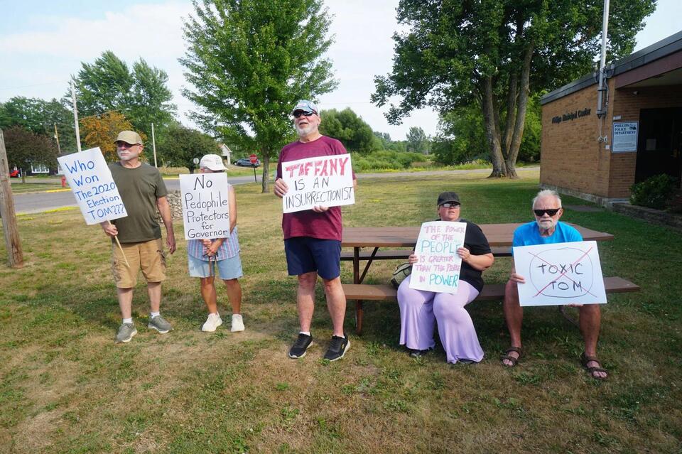 Democrats protest Tiffany at Phillips campaign stop