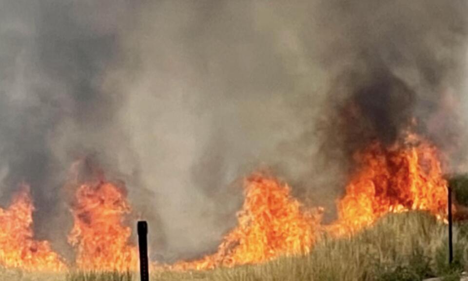 Firefighters battle brush fire that began as controlled burn on Fort ...