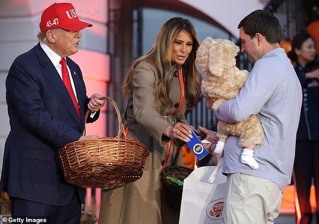 Trump pulls his own trick-or-treat as he greets children at White House Halloween event