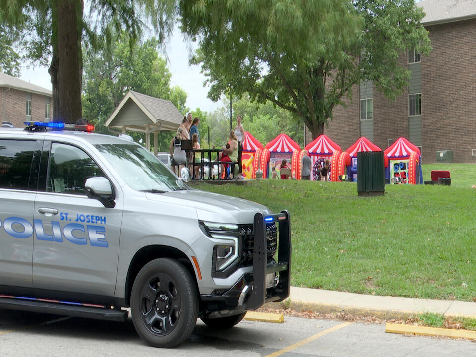 Community gathering at Museum Hill Apartments gives away backpacks, aims to ease tensions following alleged stabbing