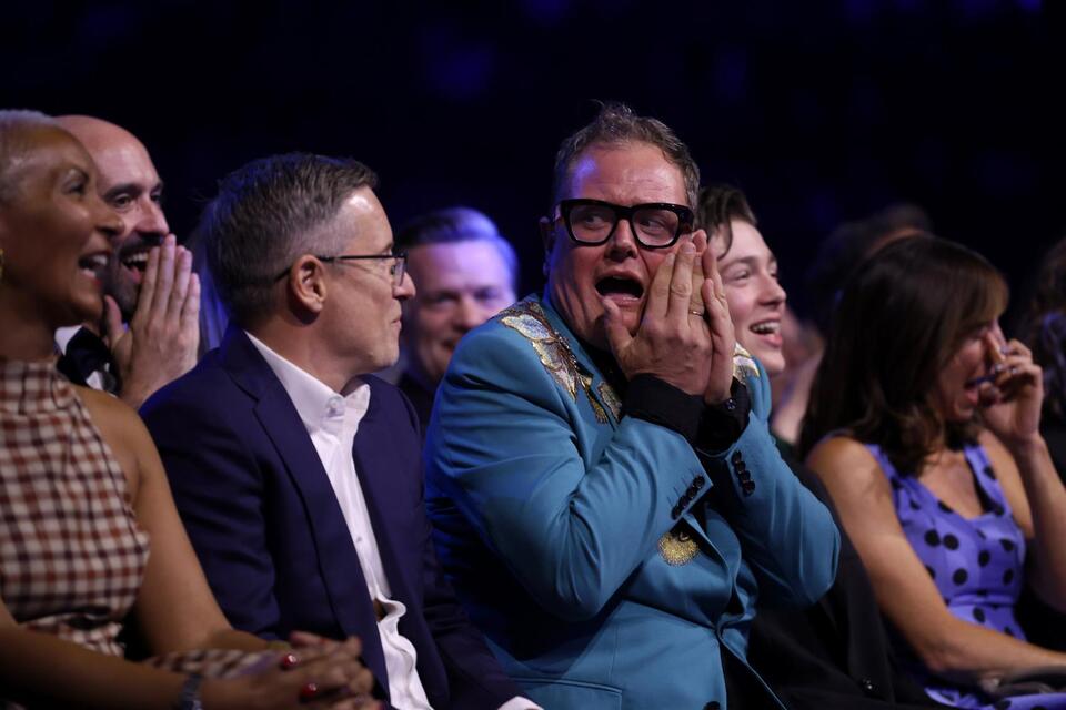 Alan Carr fights back tears after being honoured with surprise NTAs honour – and takes a swipe at Mrs Brown's Boys