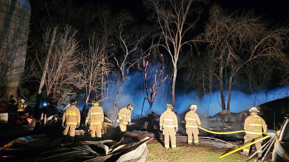 Friday morning garage fire spreads across road into field in Stratford ...