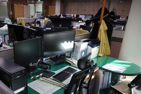 Empty desks and tears mark five colleagues killed in South Korean plane