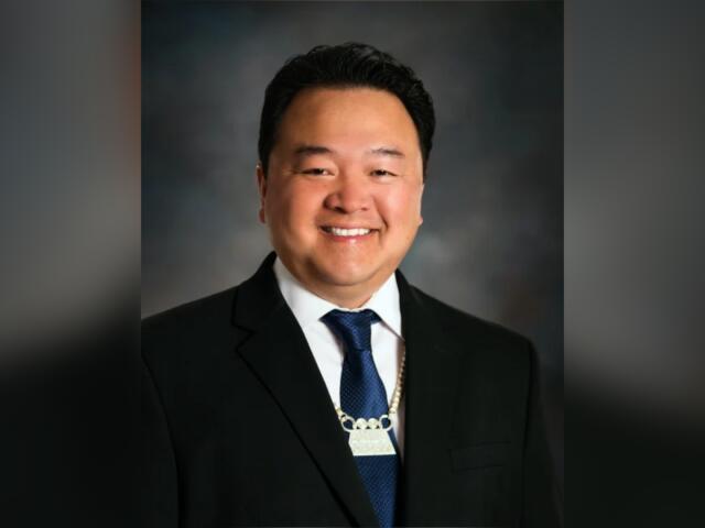 Former Green Bay school board member Kou Lee charged with election ...