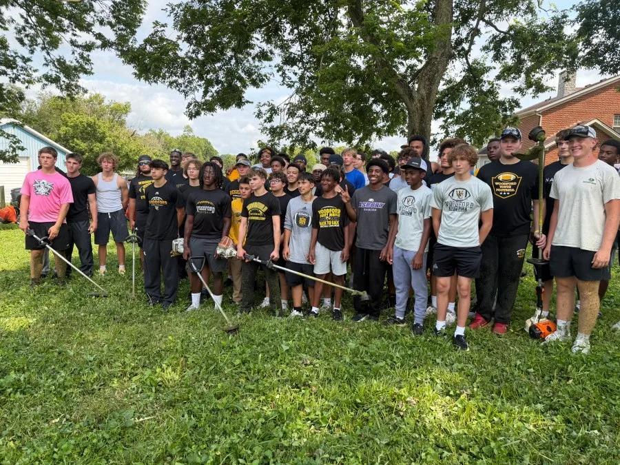 Woodford County football players clean historic cemetery