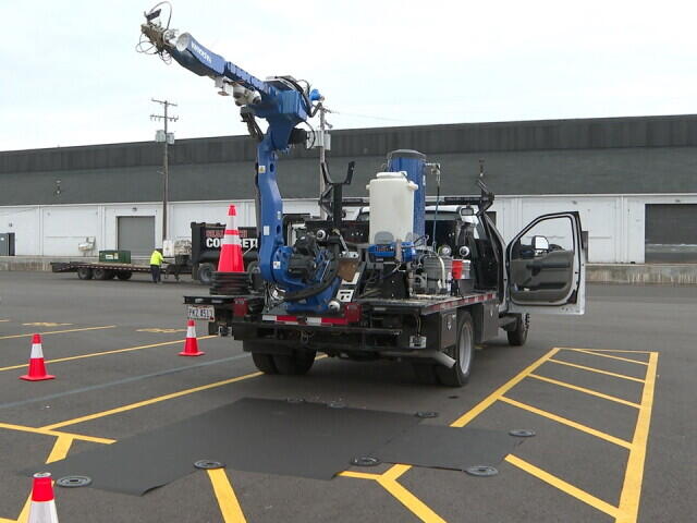 Painting roads is dangerous work. One local company has a solution.