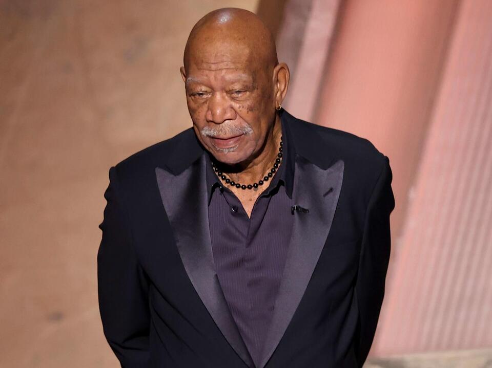 What happened to Morgan Freeman's hand, and why did he wear a glove at