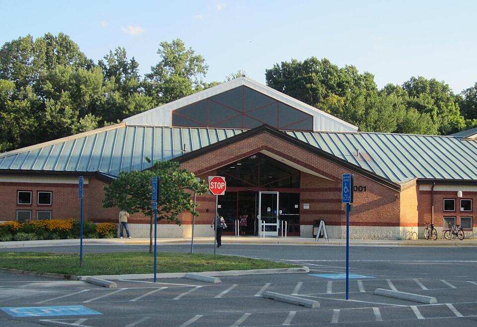 George Mason Friends installs bin for book donations - NewsBreak