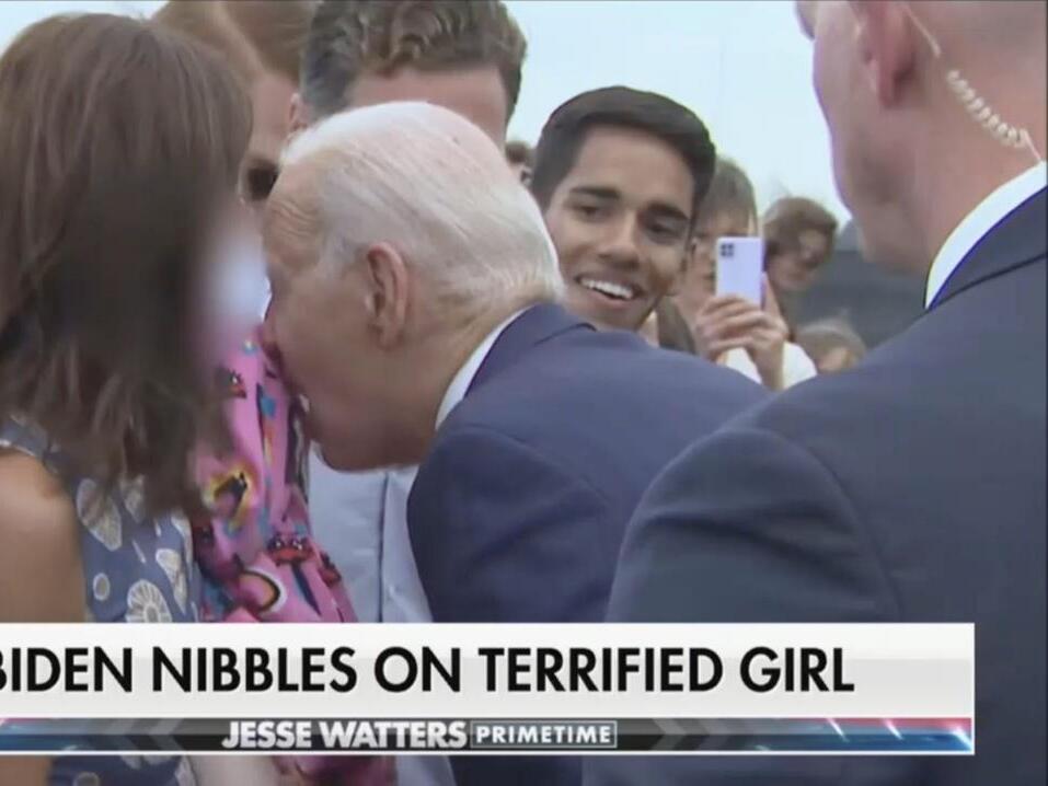 Joe Biden Nibbles Child's Dress in Bizarre Encounter in Finland