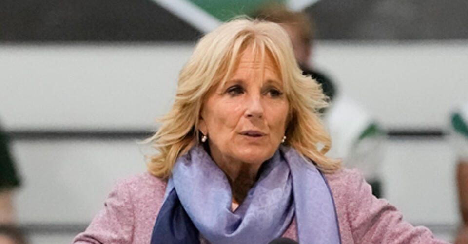 Jill Biden Does Suede Brown Heeled Boots With a Breezy White Dress for Naples School Visit – NewsBreak