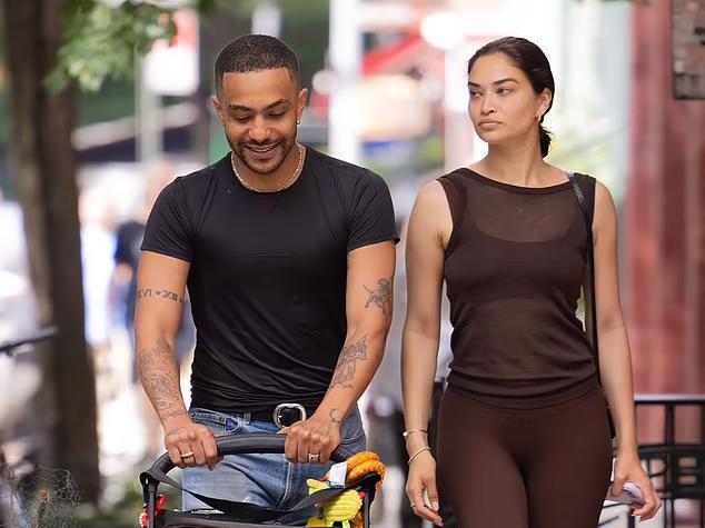 Shanina Shaik models a sheer tank top while taking her baby Zai out for