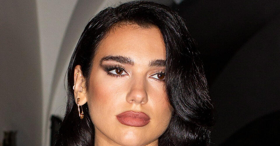 Dua Lipa Looks Bloody Good in a Dramatic Velvet Gown With Sheer Lace Slits – NewsBreak