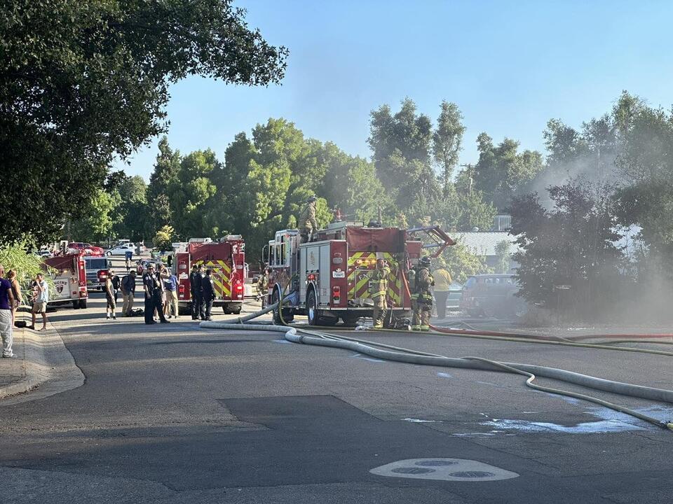 Redding Fire responding to a house fire, multiple structures involved