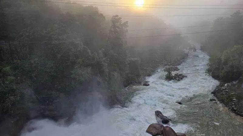 Lake Lure dam gates opening; rising water levels downstream along Broad ...