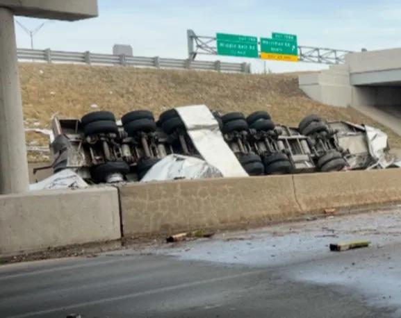 Semi-truck crashes through I-94 guard rail, flips onto Merriman Road ...
