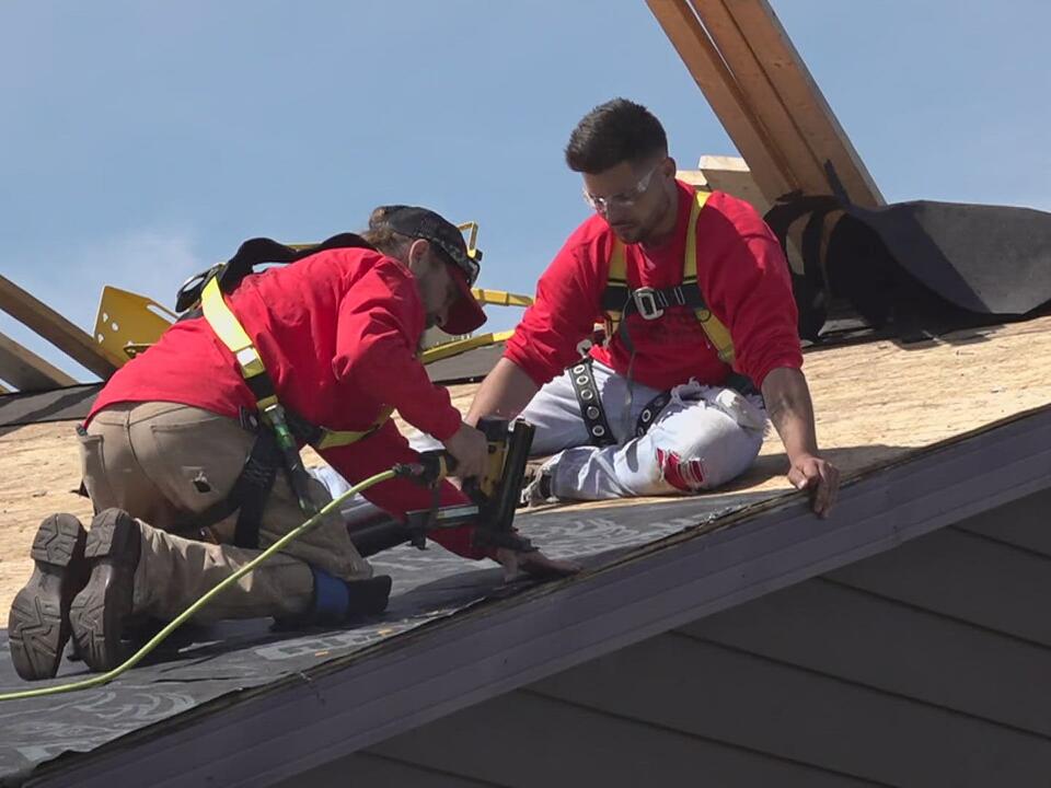 Local students help build new roof for Sterling homeless shelter