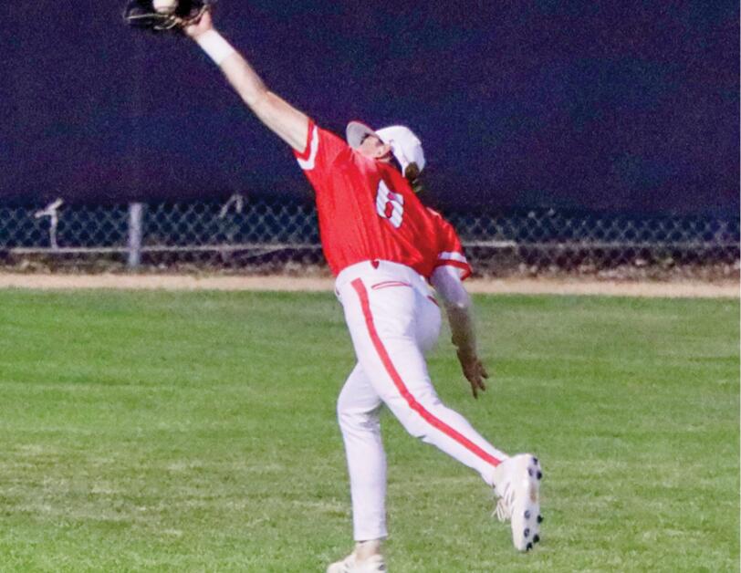 Warrior softball goes deep to top Bishop Garrigan