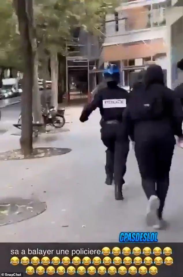 Policewoman is chased down the street, kicked to the ground and beaten ...