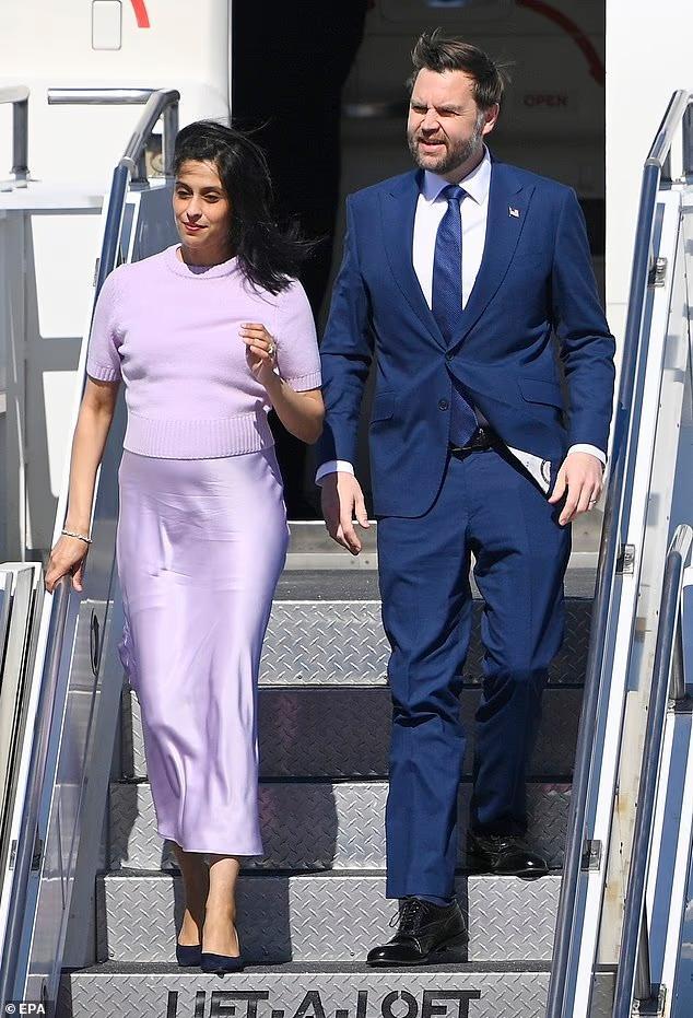 Usha Vance cradles her growing baby bump in chic lilac ensemble as she