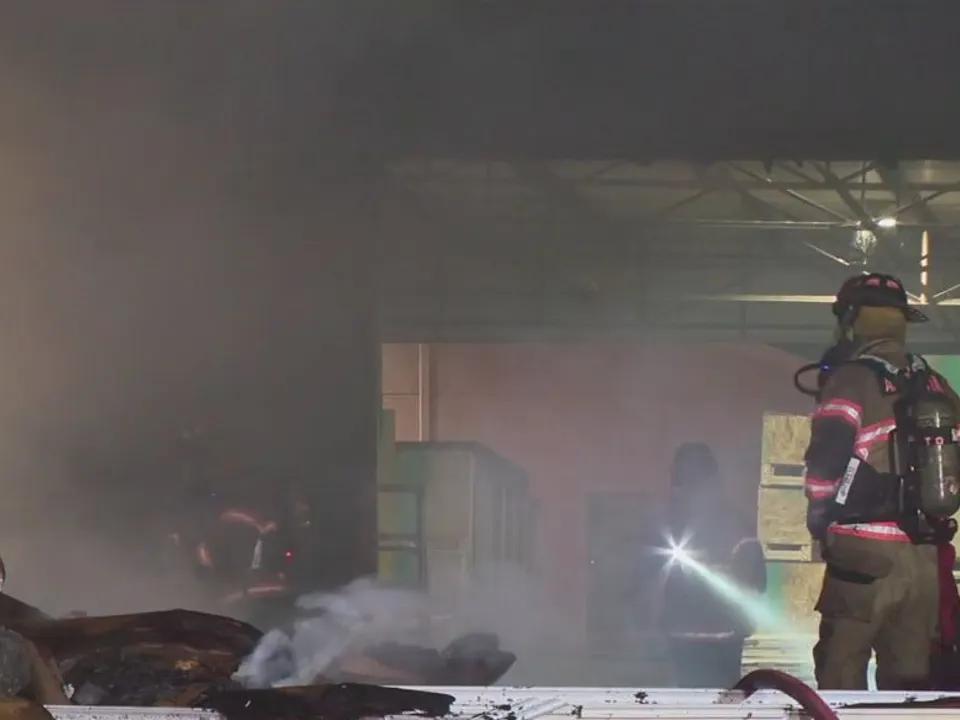 Fire crews battle massive flames at Arlington warehouse