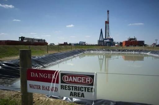 Fracking rigs like this one pictured in the United States inject water ...