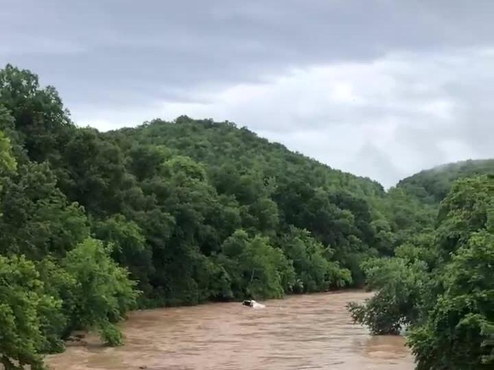 RV swept away, dozens evacuated following heavy rains